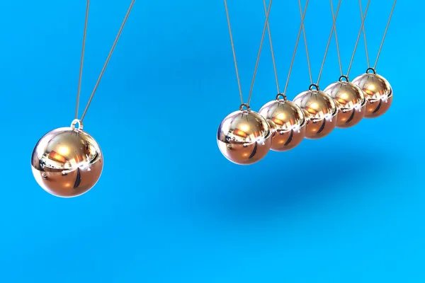 Newtons cradle na modrém pozadí — Stock fotografie