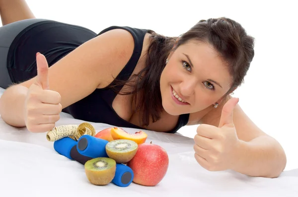 Mulher desportiva com frutas frescas — Fotografia de Stock