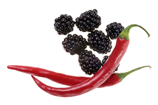 Blackberries with chili peppers — Stock Photo, Image