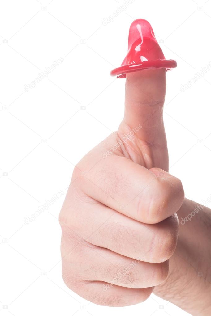 Mens Hand with condom over a white background