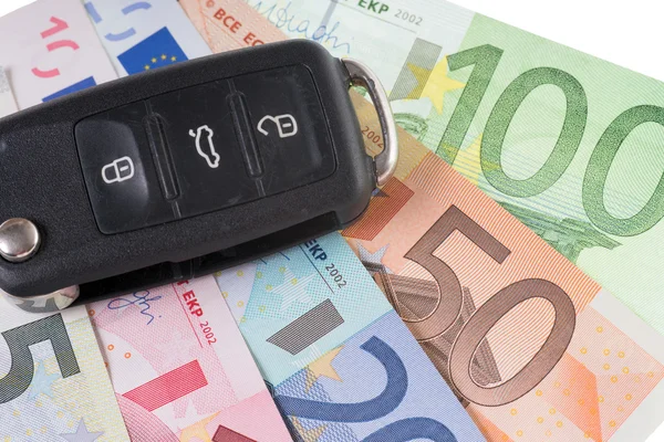 Autosleutel en geld — Stockfoto