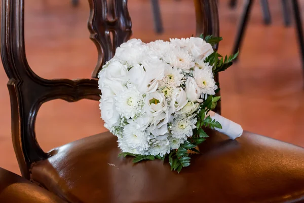 Bouquet on a chair — Stock Photo, Image