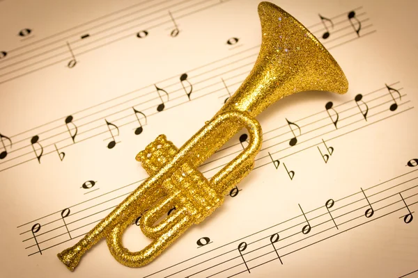 Trumpet on a musical score — Stock Photo, Image