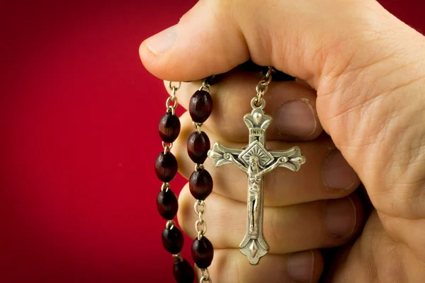 Holding a crucifix — Stock Photo, Image