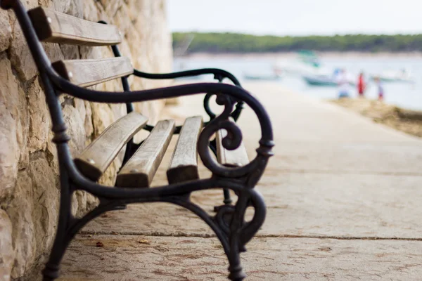 Wooden and iron bench — Stock Photo, Image