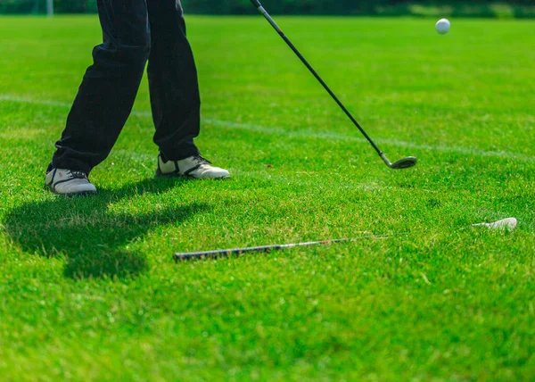 Playing golf. Golf course. Golf ball.