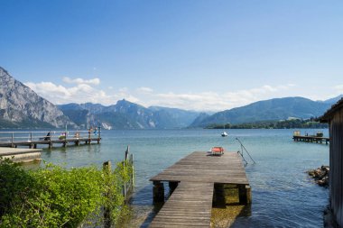 view of the lake como in the mountains with tourists