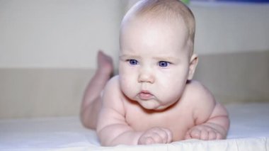 Newborn baby in the child bed