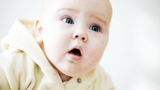 Smiling baby on the light background — Stock Video