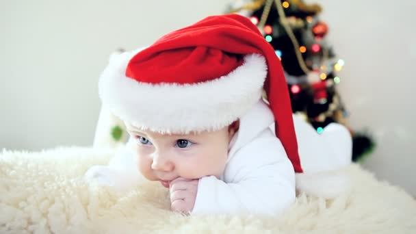 Baby in Christmas hat on the new year background — Stock Video
