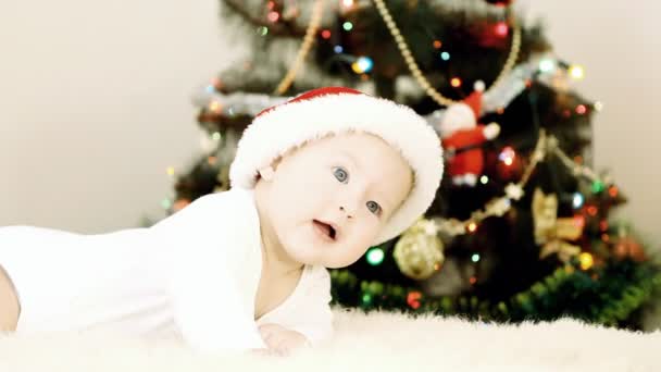 Baby in Christmas hat on the new year background — Stock Video