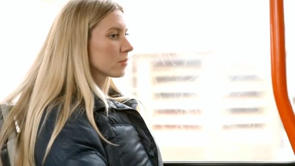 The young beautiful woman sitting in tram — Stock Video