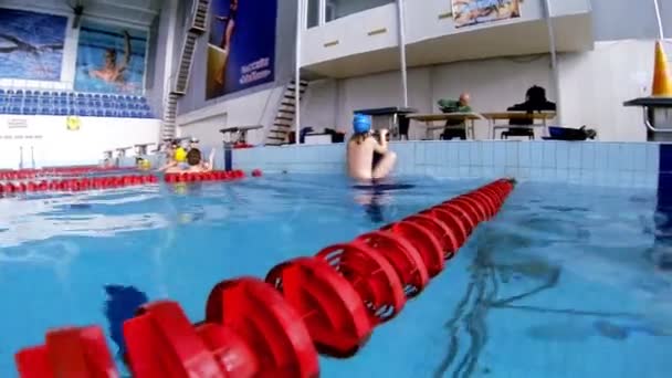 Beautiful underwater view of swimming backstorke style — Stock Video
