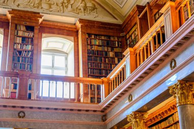 PANNONHALMA, HUNGARY - AUGUST 13, 2021: Interior of the Library of the Pannonhalma Benedictine abbey in Pannonhalma, Hungary clipart