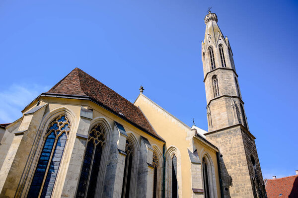 Goat The Blessed Mary Benedictine Church in Sopron on main square in Hungary on a sunny day