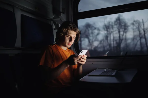Handsome Young Man Casual Clothes Sits Laptop Train Table Writes — Stock Photo, Image