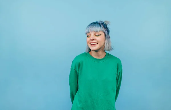 Positive Lady Colored Hair Green Sweater Stands Blue Background Looks — Stock Photo, Image