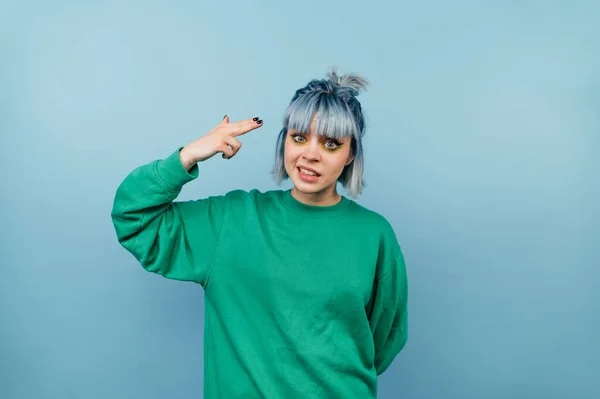 Funny Girl Colored Hair Stands Blue Background Shows Gesture Shot — Stock Photo, Image