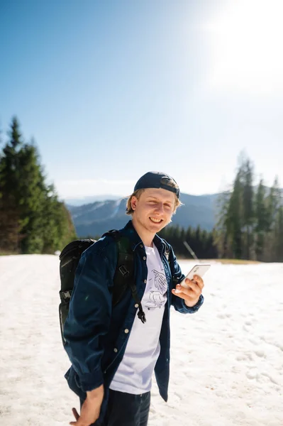 Positive Young Male Tourist Casual Clothes Standing Snow Mountains While — Foto de Stock