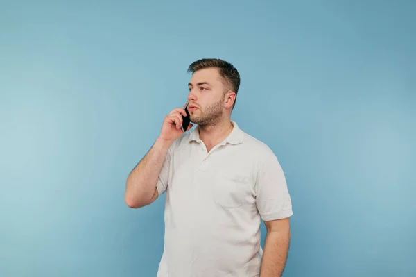 Handsome Young Man Bristles Talking Phone Blue Background — Foto de Stock