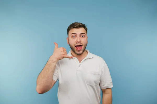 Joyful Adult Man White Shirt Bristles Shows Call Gesture Happy — стоковое фото