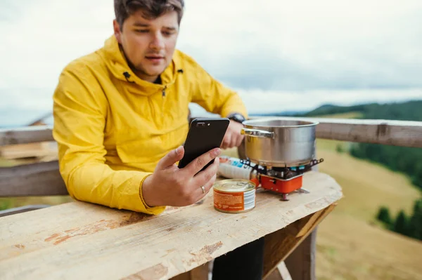 Man Sits Table Mountains Terrace Country House Prepares Food Burner — стоковое фото