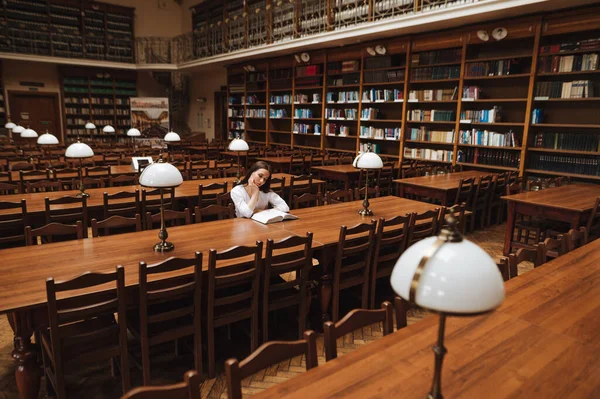 Female Student Sitting Alone Public Old Library Reading Book Serious — Fotografia de Stock