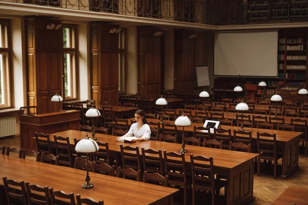 Female Student Blouse Sits Alone Empty Public Library Reads Book — Zdjęcie stockowe