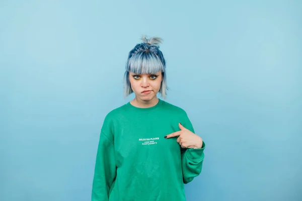 Dissatisfied Hipster Girl Colored Hair Stands Blue Background Points Finger — Stock Photo, Image