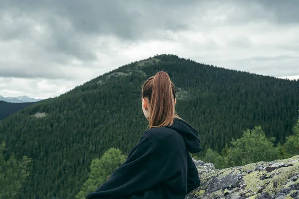 Back View Female Hiker Casual Clothes Sitting Rock Top Mountain — стоковое фото