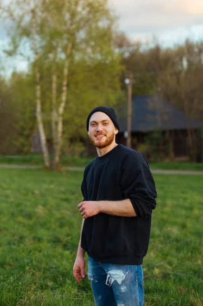 Portrait Stylish Young Man Cap Standing Outdoors Park Looking Camera — Fotografia de Stock