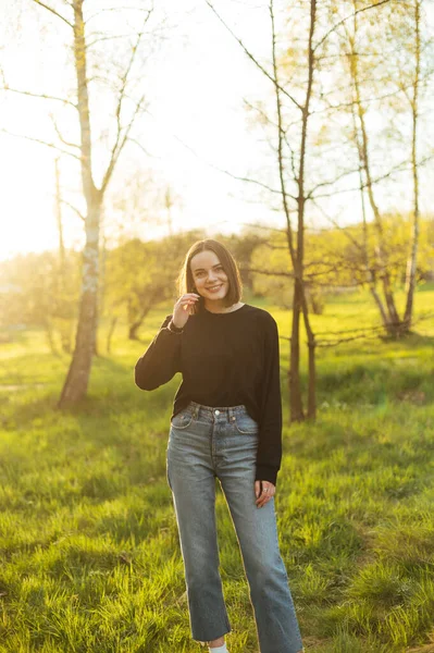 Positive Woman Casual Clothes Posing Camera Park Sunset Looking Camera —  Fotos de Stock