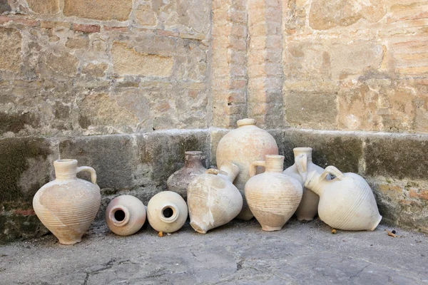 Ancient amphoras in a monastery yard — Stock Photo, Image