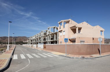 New buildings and street in Puerto de Mazarron, Spain clipart