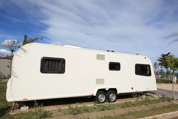 Big caravan on a camping site — Stock Photo, Image