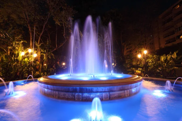 Blue illuminated fountain in Marbella, Spain — Stock Photo, Image