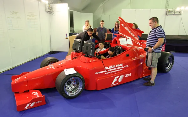 Ferrari Formula One Simulator at the Ferrari Exhibition in Estepona. July 29, 2013, Andalusia Spain — Stock Photo, Image