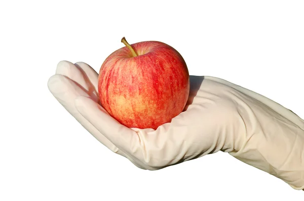 Main avec gant tenant pomme — Photo