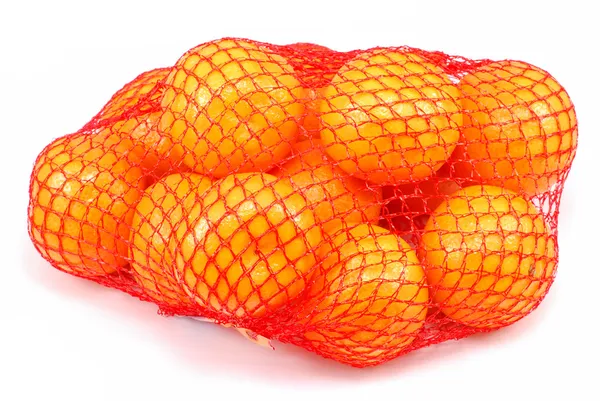 Fresh tangerines in a netted bag — Stock Photo, Image