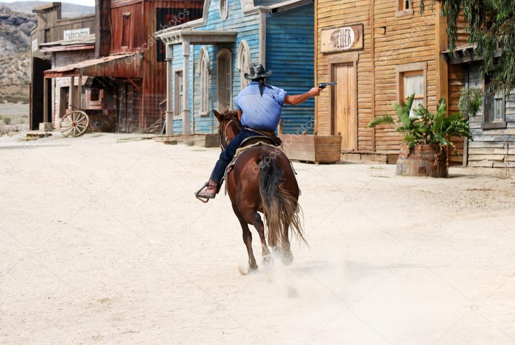 pic Cowboy Shooting On Horseback cowboy on horseback shooting and riding away stock photo image by c philipus 32028845
