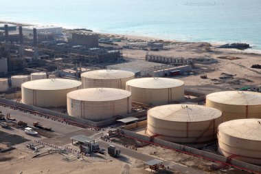 Storage tanks at the port in Dubai, United Arab Emirates clipart