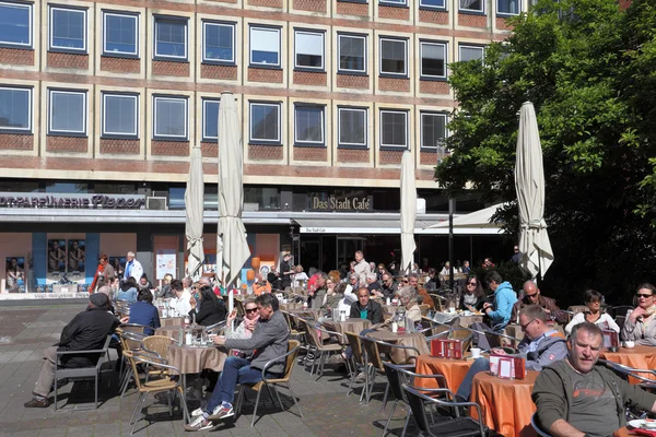Relaxing in a street cafe on a sunny day. City of Munster in North Rhine-Westphalia, Germany — Stock Photo, Image