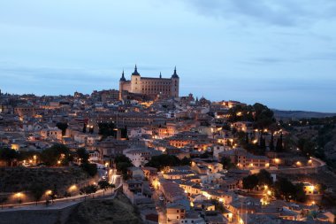 Old town of Toledo illuminated at night. Castilla-La Mancha, Spain clipart