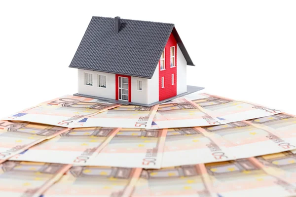 Model house and euro bills over white background — Stock Photo, Image