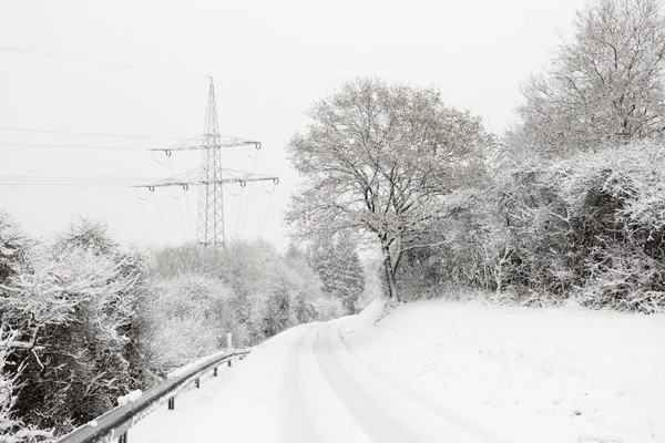 Snow-covered country road in winter — Stock Photo, Image