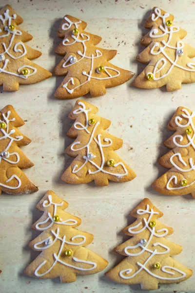 Perfect ginger bread Christmas cookie shaped as a Christmas tree, vertical image