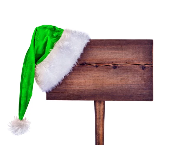 Hölzernes Verkehrsschild mit Weihnachtsmütze auf weißem Hintergrund — Stockfoto