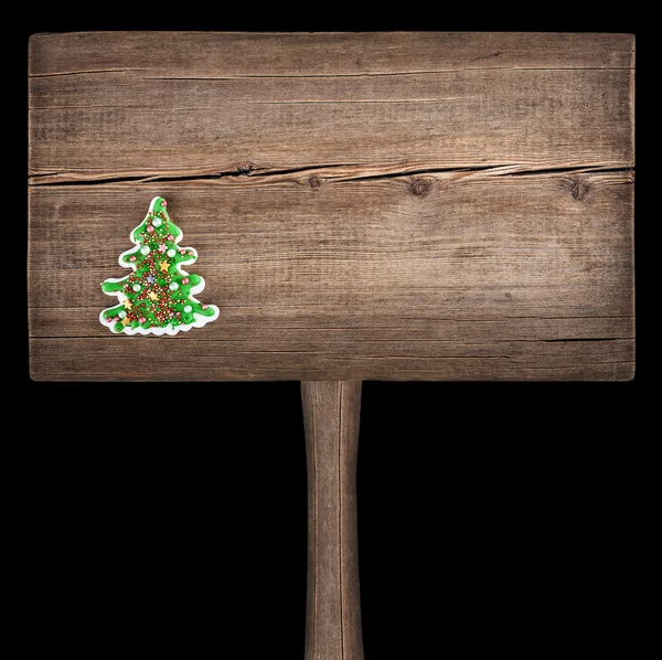 Christmas green fir tree on a wooden board. New Year background — Stock Photo, Image