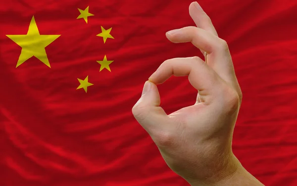 Ok gesture in front of china national flag — Stock Photo, Image