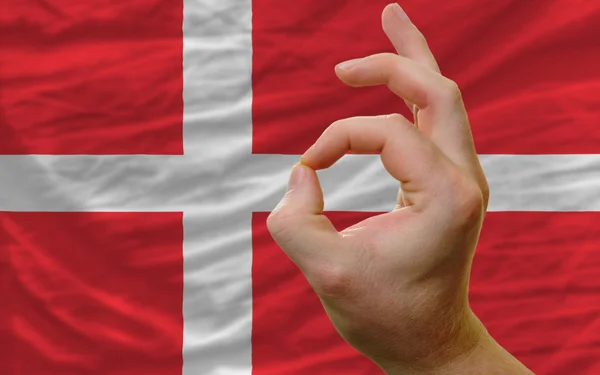 Ok gesture in front of denmark national flag — Stock Photo, Image